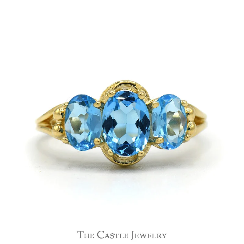 ladies rings with ruby red -Triple Oval Cut Blue Topaz Ring with Split Shank Sides in 14k Yellow Gold