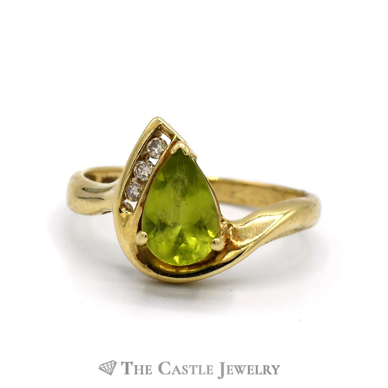 ladies rings small size fit -Pear Cut Peridot Ring with 3 Round Diamond Accents in 10k Yellow Gold