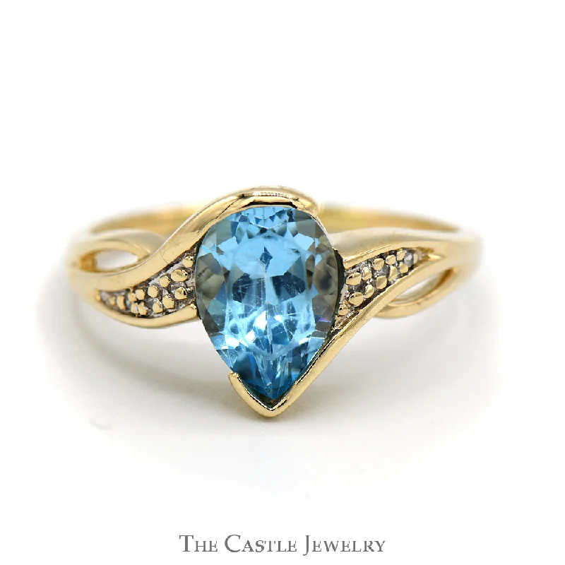 ladies rings with crystal accents -Pear Shaped Blue Topaz Ring with Illusion Set Diamond Accents in 10k Yellow Gold