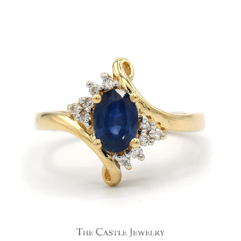 ladies rings luxury brand name -Oval Sapphire Ring With .05 CTTW of Diamonds in Bypass Design 14 KT Yellow Gold