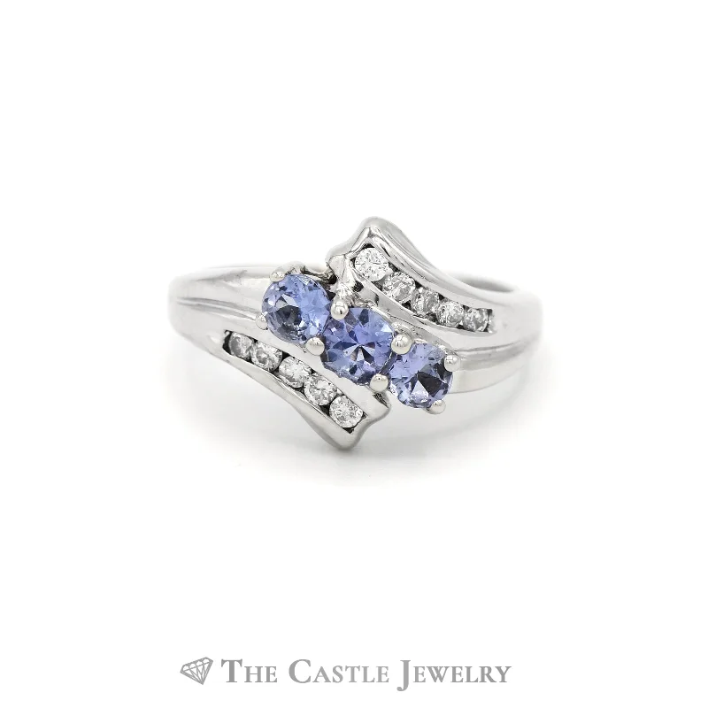 ladies rings with blue sapphire -.15CTTW Diamond and Tanzanite Bypass Ring in 14KT White Gold