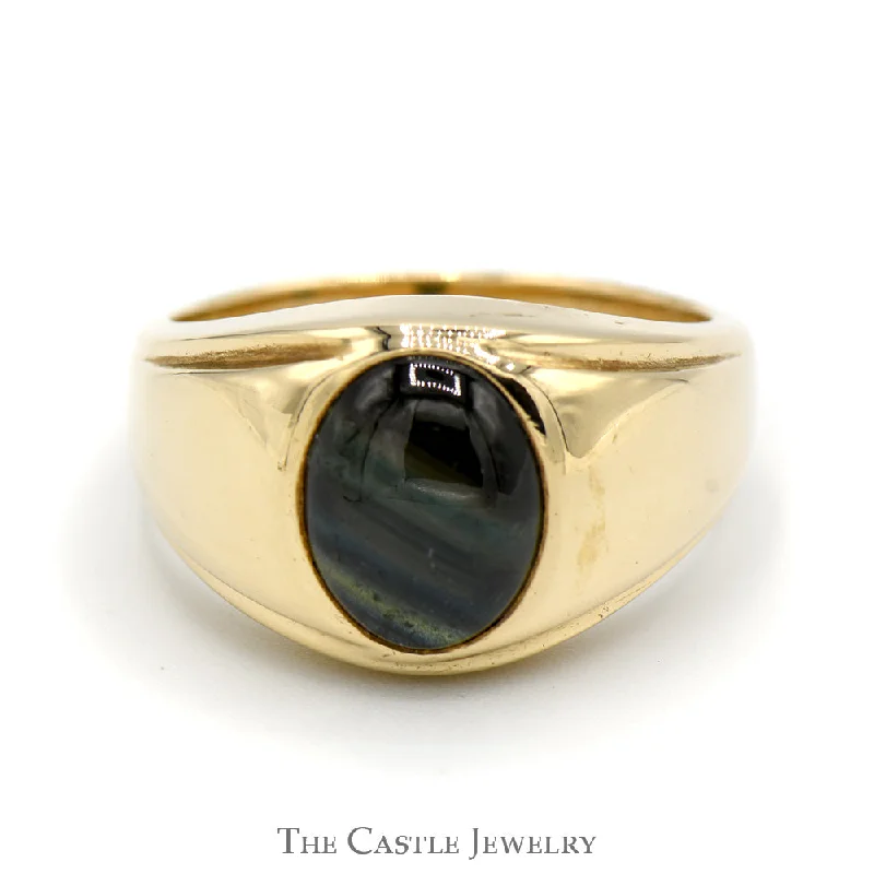 ladies rings with topaz blue -Oval Cabochon Black Star Sapphire Ring with Polished Sides in 14k Yellow Gold