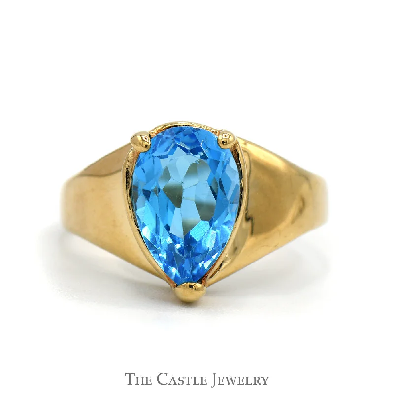 ladies rings with crystal accents -Pear Cut Blue Topaz Ring with Tapered Band in 10k Yellow Gold