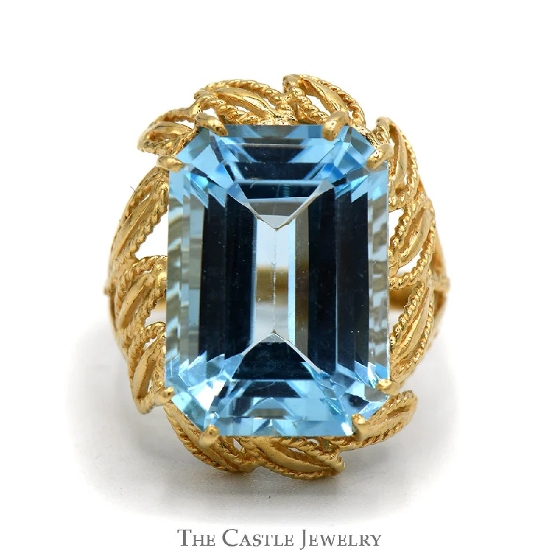 ladies rings for party wear -Emerald Cut Blue Topaz Ring with Fancy Leaf Designed Open Setting in 10k Yellow Gold