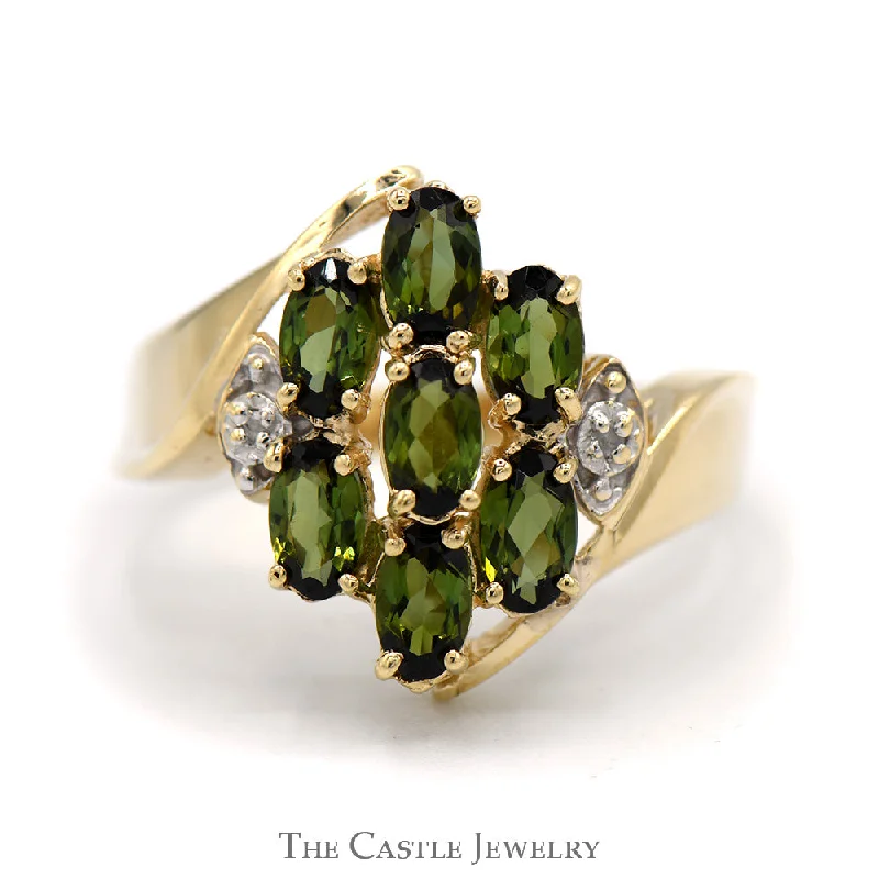 ladies rings for stylish women -Oval Tsavorite Garnet and Diamond Cluster Ring With .01 CTTW in Bypass Style 10 KT Yellow Gold