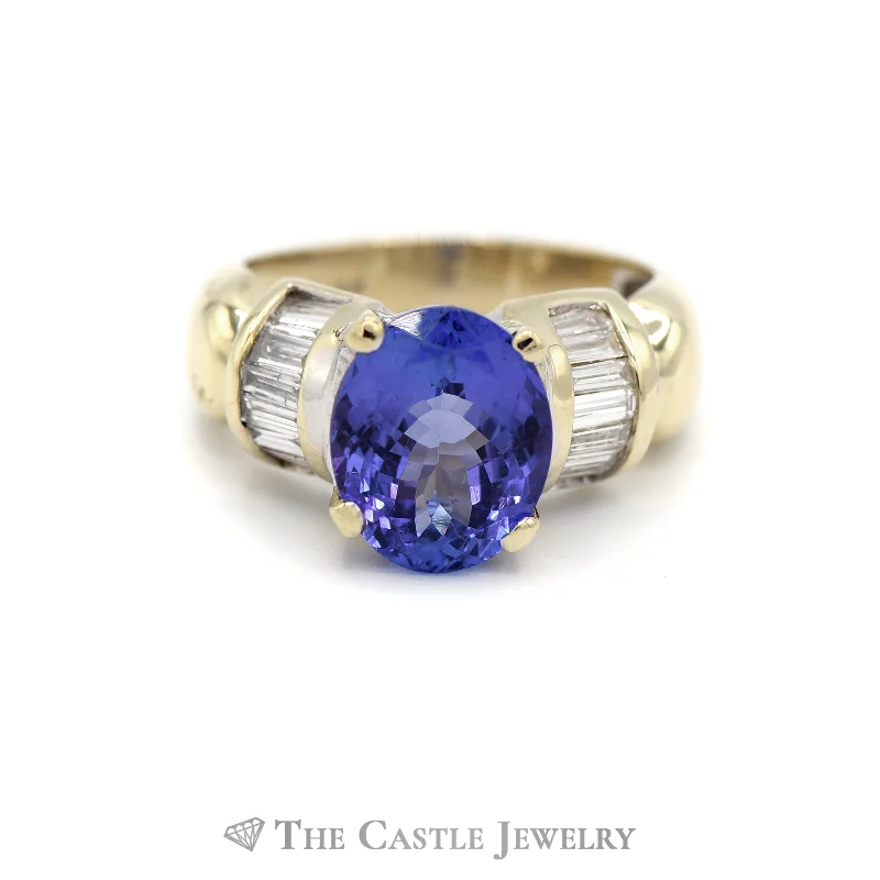 ladies rings adjustable size fit -Oval Tanzanite Ring with Baguette Diamond Accents in 14k Yellow Gold